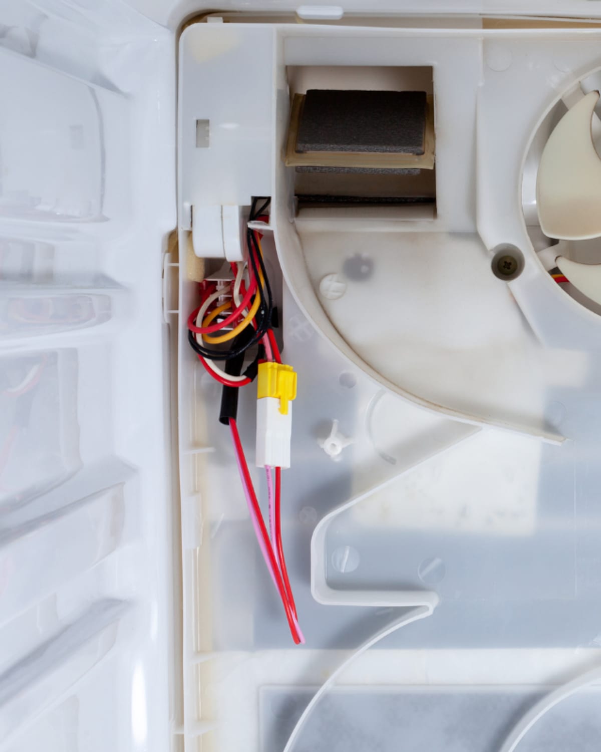 Saunders Appliance Repair technician diagnosing an appliance in a Huntington, WV kitchen